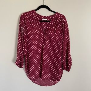 Pleione red tunic with white polka dots. 3/4 length sleeves.